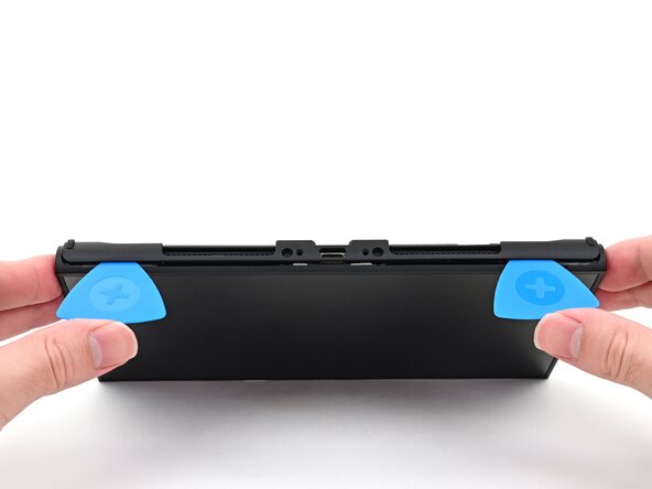 Nintendo Switch 2 Microphone Replacement, Remove the back cover: crwdns2935265:017crwdnd2935265:01crwdnd2935265:03crwdne2935265:0