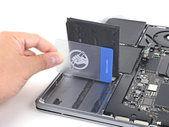 MacBook Pro 13" 2022 (M2) Battery Replacement, Separate the right battery cell: crwdns2935265:034crwdnd2935265:03crwdnd2935265:03crwdne2935265:0
