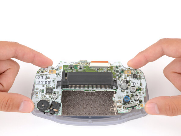 Game Boy Advance LCD Screen Replacement, Reposition the motherboard: crwdns2935265:010crwdnd2935265:02crwdnd2935265:03crwdne2935265:0