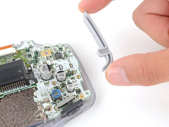 Game Boy Advance Speaker Replacement, Remove the side bumpers: crwdns2935265:07crwdnd2935265:02crwdnd2935265:03crwdne2935265:0