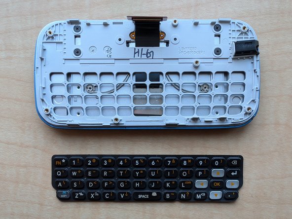 LG Extravert 2 Teardown, Remove the keyboard membrane: crwdns2935265:09crwdnd2935265:02crwdnd2935265:02crwdne2935265:0
