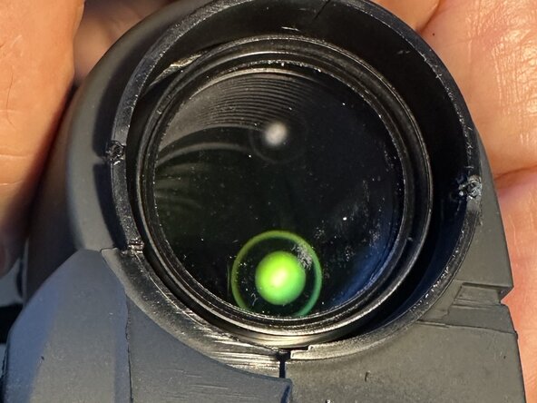 Canon Binocular 10x30 IS Battery cover Replacement, Removing the bottom cover, part B: crwdns2935265:02crwdnd2935265:02crwdnd2935265:02crwdne2935265:0