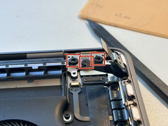 2018 MacBook Pro 13" Touch Bar Replacement, Loosen the screen hinge near the Touch Bar connectors: crwdns2935265:038crwdnd2935265:02crwdnd2935265:02crwdne2935265:0