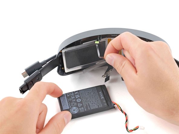 HTC Vive XR Elite Headstraps Replacement, Remove the left battery cell: crwdns2935265:028crwdnd2935265:03crwdnd2935265:03crwdne2935265:0