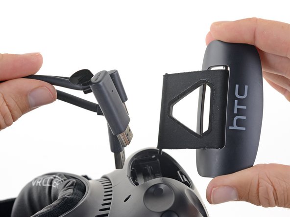 HTC Vive Compartment Cover Assembly Replacement, Remove the compartment cover assembly: crwdns2935265:06crwdnd2935265:02crwdnd2935265:02crwdne2935265:0