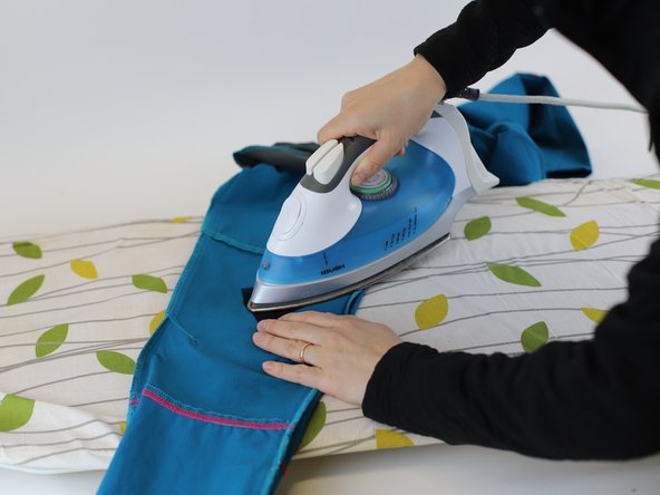 How to repair a hole in woven textile (using an iron-on patch), Iron the patch: crwdns2935265:03crwdnd2935265:02crwdnd2935265:03crwdne2935265:0