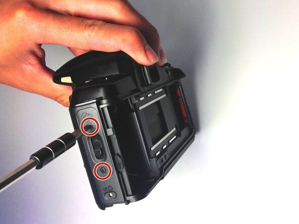 Pentax PZ-10 Back Cover Locking Switch Spring Replacement, Removing the Side Panel: crwdns2935265:06crwdnd2935265:01crwdnd2935265:01crwdne2935265:0