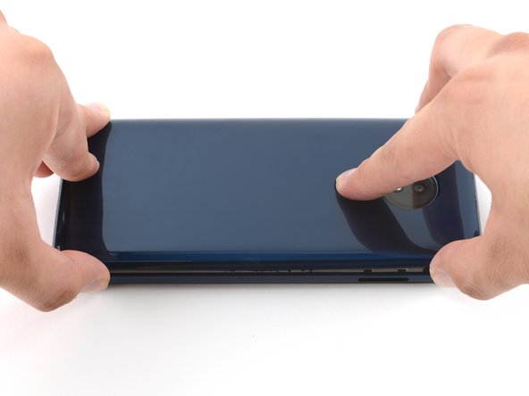 This will prevent damage to the fingerprint sensor connector under the left side of the rear cover.