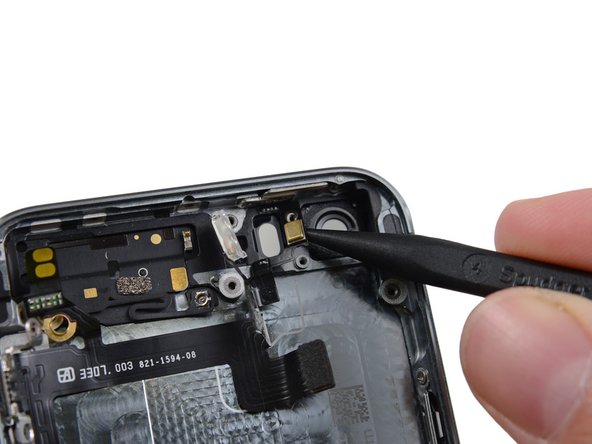 Use the tip of a spudger to free the microphone portion of the assembly from the case.