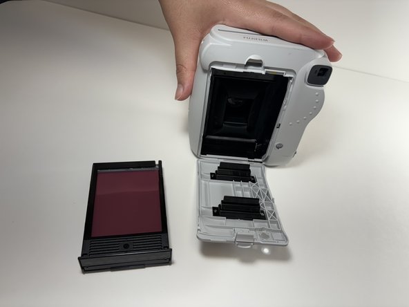 Fujifilm Instax Mini 9 Flash Capacitor Replacement, Remove the Film Cartridge: crwdns2935265:03crwdnd2935265:02crwdnd2935265:02crwdne2935265:0