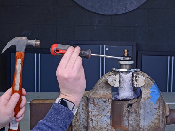 Wrap the cylinder in a rag to prevent scratching the outside of the cylinder.