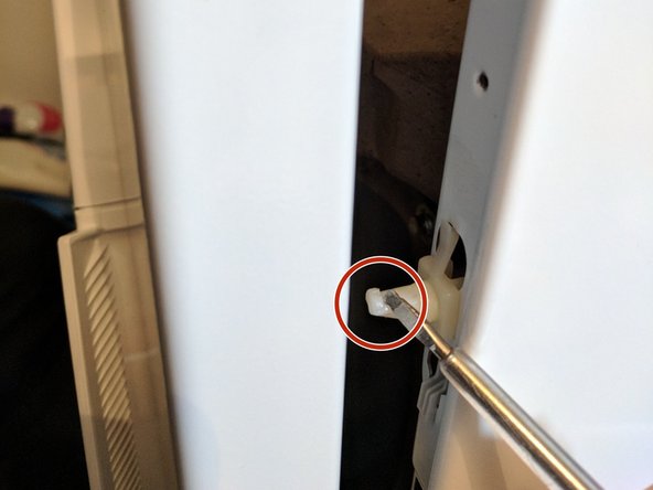 Washing Machine Disassembly to Access Water Drain Pump, Remove front cover: step 10, image 1 of 3