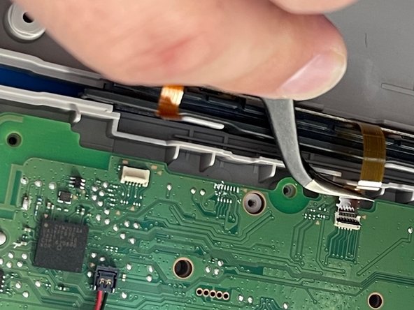 Left Nintendo Switch NES Controller Charging Rail Replacement, Pry the ZIF connectors up: crwdns2935265:03crwdnd2935265:03crwdnd2935265:03crwdne2935265:0